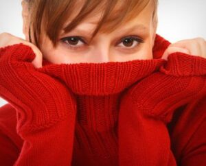 Woman Hides Smile Looking for Same Day tooth Replacement from Hillsboro Dental Excellence