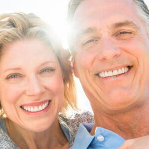 Happy Couple Considers Cost of Dental Implants from Hillsboro Dental Excellence