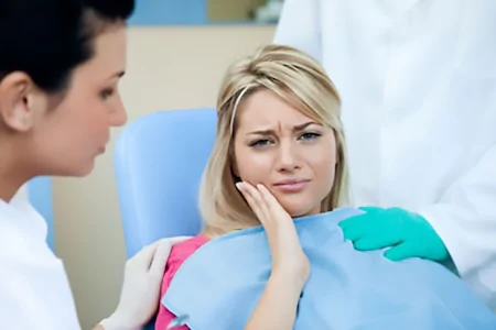 A patient having an emergency dental problem at a dentist's office.