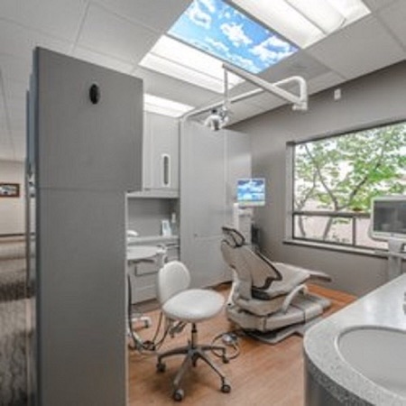 A view of a dental office with a dental chair and invisalign Itero Digital Dental Scanner