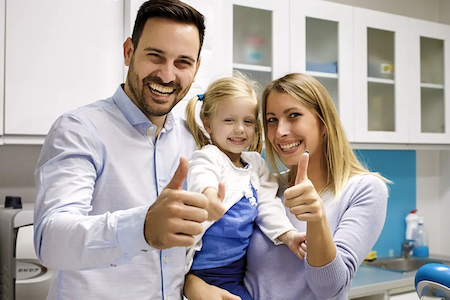 A happy family after consulting with our dentist at Hillsboro Dental Excellence.