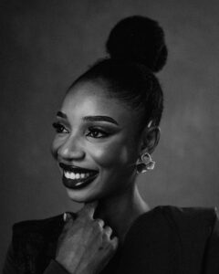 Smiling woman with elegant hairstyle and earrings