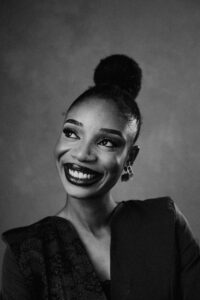 Smiling woman in elegant black attire