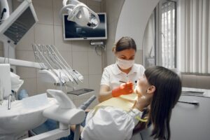 Dentist performing check-up on patient