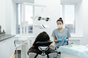 Dentist with patient in modern dental clinic